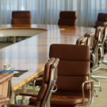 Picture of a boardroom table at a college campus