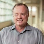 Headshot of Eric Moss.