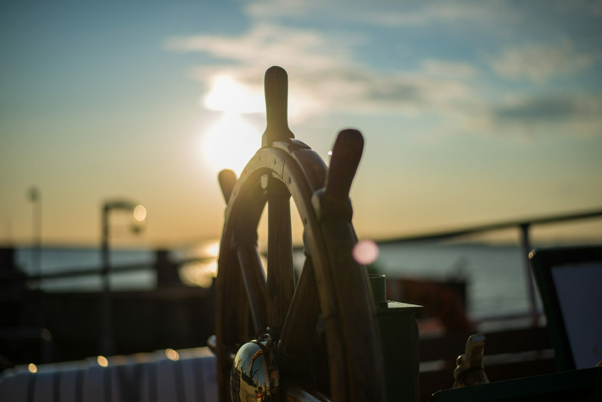 ships wheel wheel of a ship in the sunset
