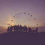 graduating students throwing caps