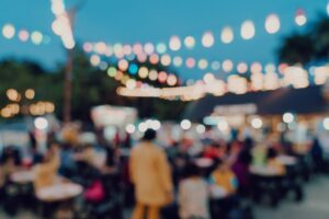 blurred background at night event, people walking around