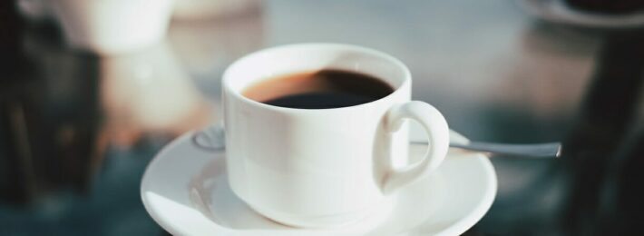 360° Feedback - Image of sitting down to listen with a cup of coffee