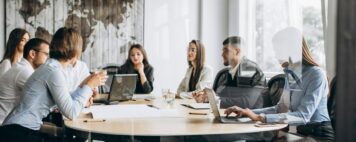 Group of people working out business plan in an office