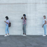 Students standing in a socially-distanced line.