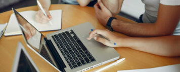 Young team working together and use a laptop