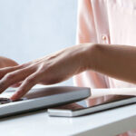 Woman typing on computer