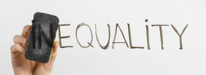 Equality written on a dry erase board