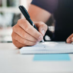 Man writing in a notebook