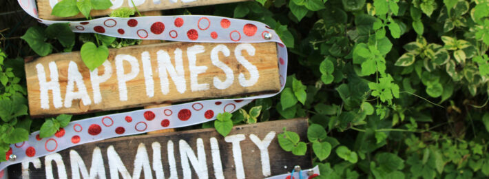 Health, Goodness, Happiness, Community sign