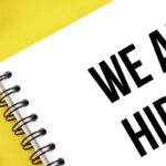 We are hiring written on a notepad