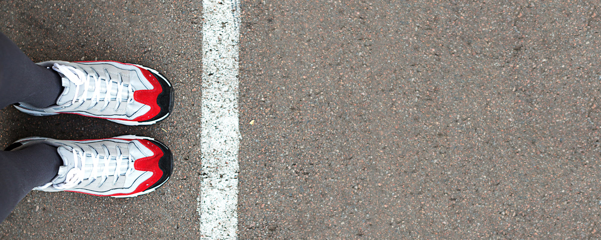Person standing near a dividing line