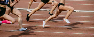 Group of athletes running on a track