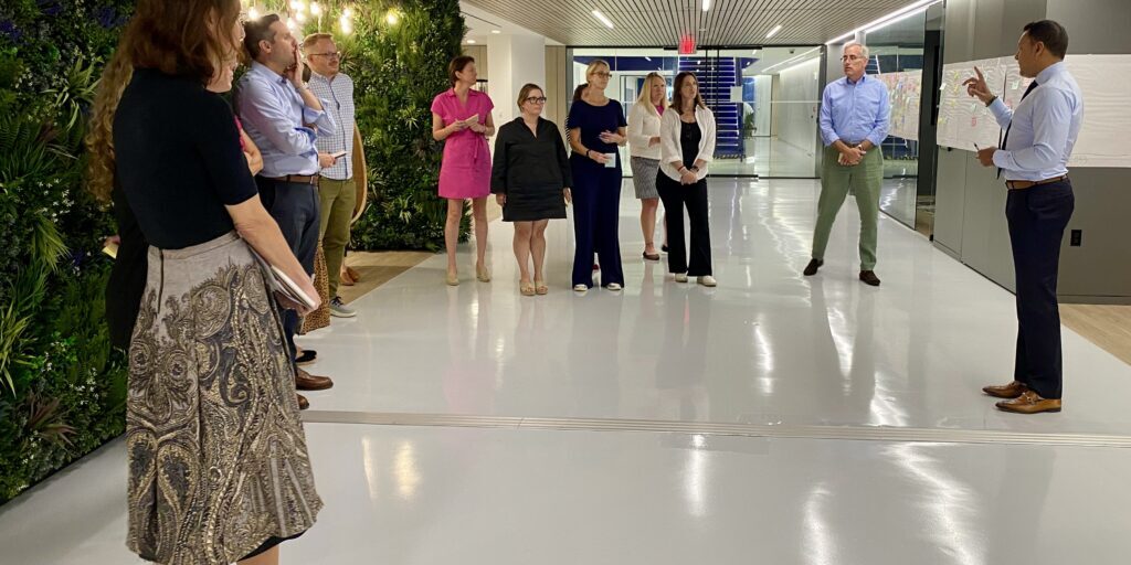 People in conversation at an Academic Impressions conference